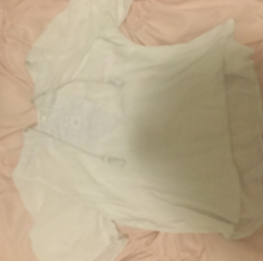Very flowy, trendy cut white top.